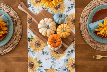 Wall Mural - Top view of pretty fall tablescape with colorful pumpkins