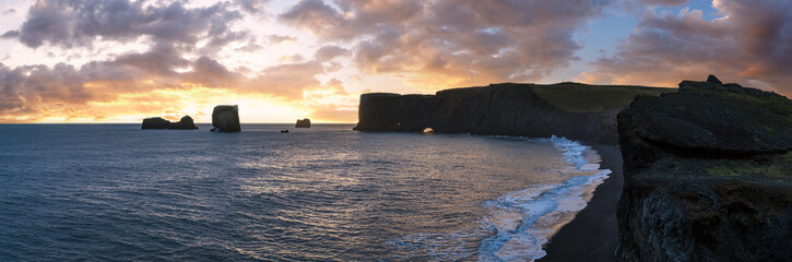 Picturesque autumn evening view Dyrholaey Cape, beach and  rock formations. Vik, South Iceland.