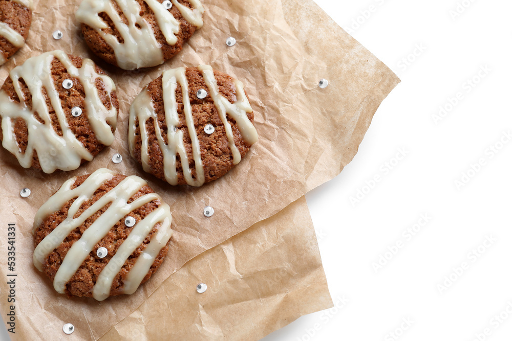 Baking paper with Halloween mummy cookies on white background, closeup