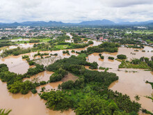 Aerial View River Flood Village Countryside Asia And Forest Tree, Top View River With Water Flood From Above, Raging River Running Down Jungles Lake Flowing Wild Water After The Rain
