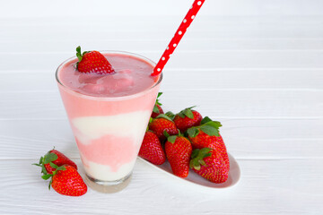 Wall Mural - Strawberry yogurt fruit juice smoothie pink colorful fruit juice milkshake blend beverage healthy high protein the taste yummy In glass drink episode morning on white wood background.