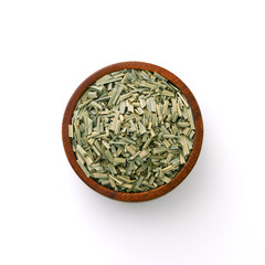 Wall Mural - Dry lemongrass leaves slices in wooden bowl isolated on white background , top view , flat lay.