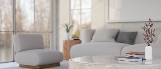 Modern marble coffee table with copy space against blurred minimal and comfortable living room