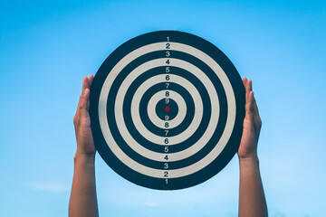 Wall Mural - Bullseye has red dart arrow throw hitting the center of a shooting for business. targeting and winning goals business.