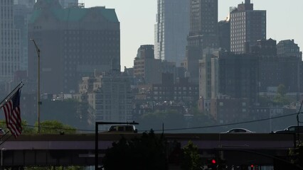 Wall Mural - 4K video with a lot of cars driving in rush hour traffic on East River Drive (FDR) highway street. Manhattan skyscraper office buildings in background. New York City, 2022.