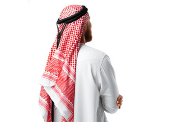 Wall Mural - Back view of an Arab man standing on white isolated background