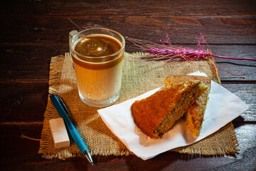 Wall Mural - Coffee and banana cake on vintage wooden table.