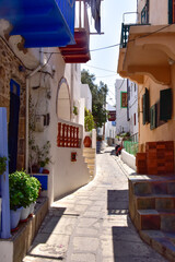 White houses with blue shutters, balconies, the traditional Greek village of Mandraki on the island of Nisyros.