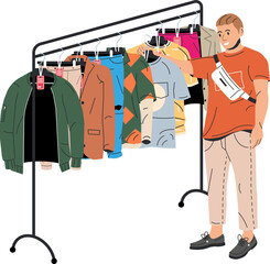 Wall Mural - Man near rack with clothes