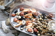 Mediterranean, raw seafood mix on a metal plate, top view. Marine composition, selective focus. Fish shop assortment.