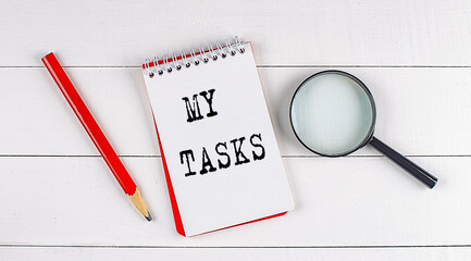 Poster - MY TASKS text on notebook on white wooden background , business concept
