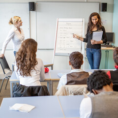 Teenage Students: Class Presentation. A student giving a presentation to her classmates. From a series of related images.