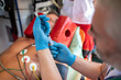 © zinkevych - Ambulance doctor preparing to administer an injection to a patient