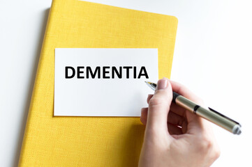 Wall Mural - Doctor holding a card with text DEMENTIA,medical concept