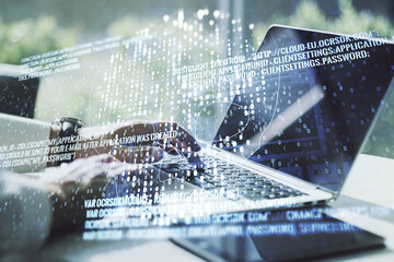 Poster - Creative concept of code skull illustration and hands typing on laptop on background. Hacking and phishing concept. Multiexposure