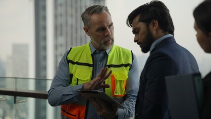 Engineer and businessman talking. Project planing between engineer foreman manager and businessman, Construction workers, Contractor.