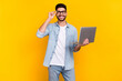 © deagreez - Photo of cheerful latin young guy touch eyewear visit remote work conference wear stylish denim look isolated on yellow color background