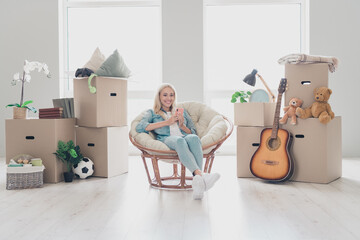 Sticker - Photo of positive sweet young lady dressed denim shirt booking modern device new room indoors apartment