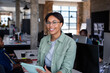 © ReeldealHD images - Portrait of African American businesswoman holding a digital tablet in a creative media office