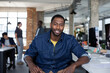 © ReeldealHD images - Portrait of African American businessman sitting at desk in an office