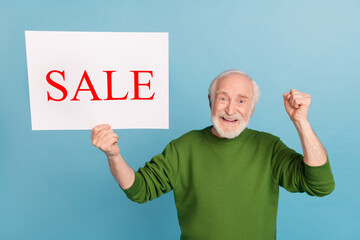 Sticker - Photo of delighted satisfied funny granddad raise fist celebrate luck success isolated on blue color background