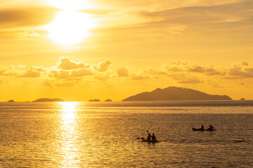 Wall Mural - beautiful gold sunset of reflection on sea wave with skyline background, summer twilight landscape