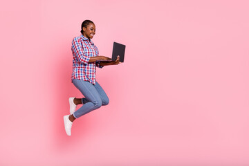 Canvas Print - Full body profile photo of attractive energetic lady jump hold netbook empty space isolated on pink color background