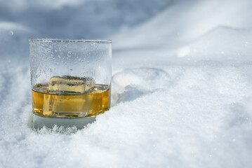 Whiskey on the rocks in the snow