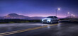 © 3dartists - Generic car driving at night on a suburban highway with an city landscape and mountains in the background. 3d rendering