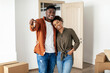 © Prostock-studio - African American Millennial Couple Showing Key Posing In New House