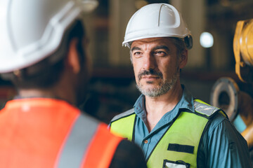 professional industrial engineers in hard hats. working at heavy industry manufacturing factory, man worker in an construction industrial job, maintenance service check for safety first concept