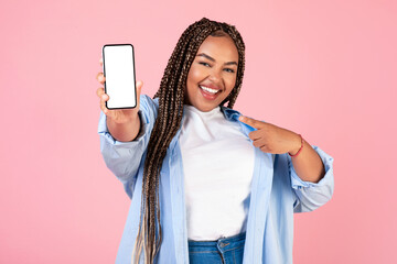 Wall Mural - African American Female Showing Mobile Phone Empty Screen, Pink Background