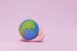 Fototapeta Pokój dzieciecy - slow changes on the planet. a snail carrying a planet on a pink background. 3D render
