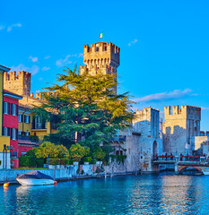 Wall Mural - The tall towers of Castello Scaligero behind the port, Sirmione, Italy