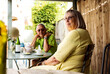 © Cavan Images - retired couple happily sat having coffee and tea at a cafe