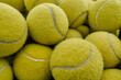 Bunch of yellow tennis balls, horizontal from above close-up shot, professional sport concept background