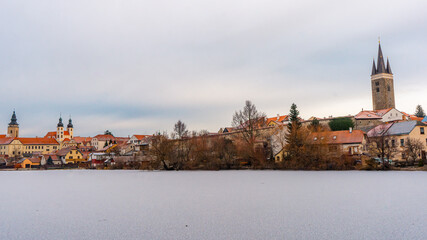 Wall Mural - Telc , beautiful  old town , buildings along the river during winter morning : Telc , Czech  : December 14, 2019