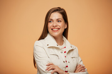 Wall Mural - Smiling woman in white jacket looking away. isoalted portrait on yellow background.