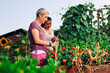© zorandim75 - Mother and daughter gardening together.Gardening discovering and teaching.