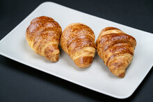 White Plate With Tasty Croissants With Butter. French Cuisine.