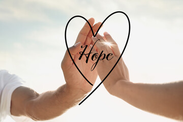 Wall Mural - Concept of hope. Man and woman reaching hands to each other, closeup