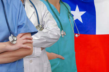 Wall Mural - Three Doctors with stethoscope in standing on Chile flag background. Close-up medical team. Group of doctors and nurses. Innovative technologies in science and medicine, medical development in Chile