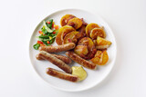 Fototapeta Zwierzęta - Fried potatoes and sausages for lunch