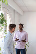© Renata Hamuda - two young multiethnic businessmen using a digital tablet together at work