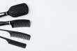 © Iuliia Alekseeva - Set  black hair combs. White background. Place for text.