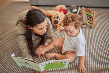 Mother, baby and book for story for education on carpet in home, for learning and reading skills. Child, mom and teaching with storybook for development of mind, brain or thinking ability in house