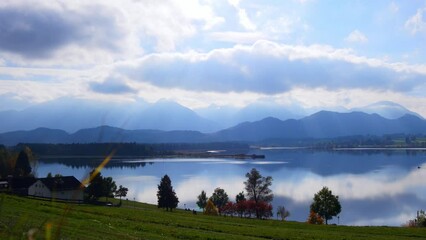 Canvas Print - Autumn at the lake with clouds and mountains