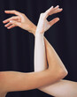 Women, hands and ballet dance arms on black studio background in art for theatre, training or performance. Female ballerina hand and arm choreography of dancers in creative team stance for diversity