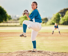 Wall Mural - Baseball pitcher, ball sports and a athlete woman ready to throw and pitch during a competitive game or match on a court. Fitness, workout and exercise with a female player training outside on field