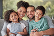 Smile, portrait and happy family love to relax together in a positive home on a fun weekend for bonding. Happiness, mother and father smiling with young Latino kids or children enjoying quality time